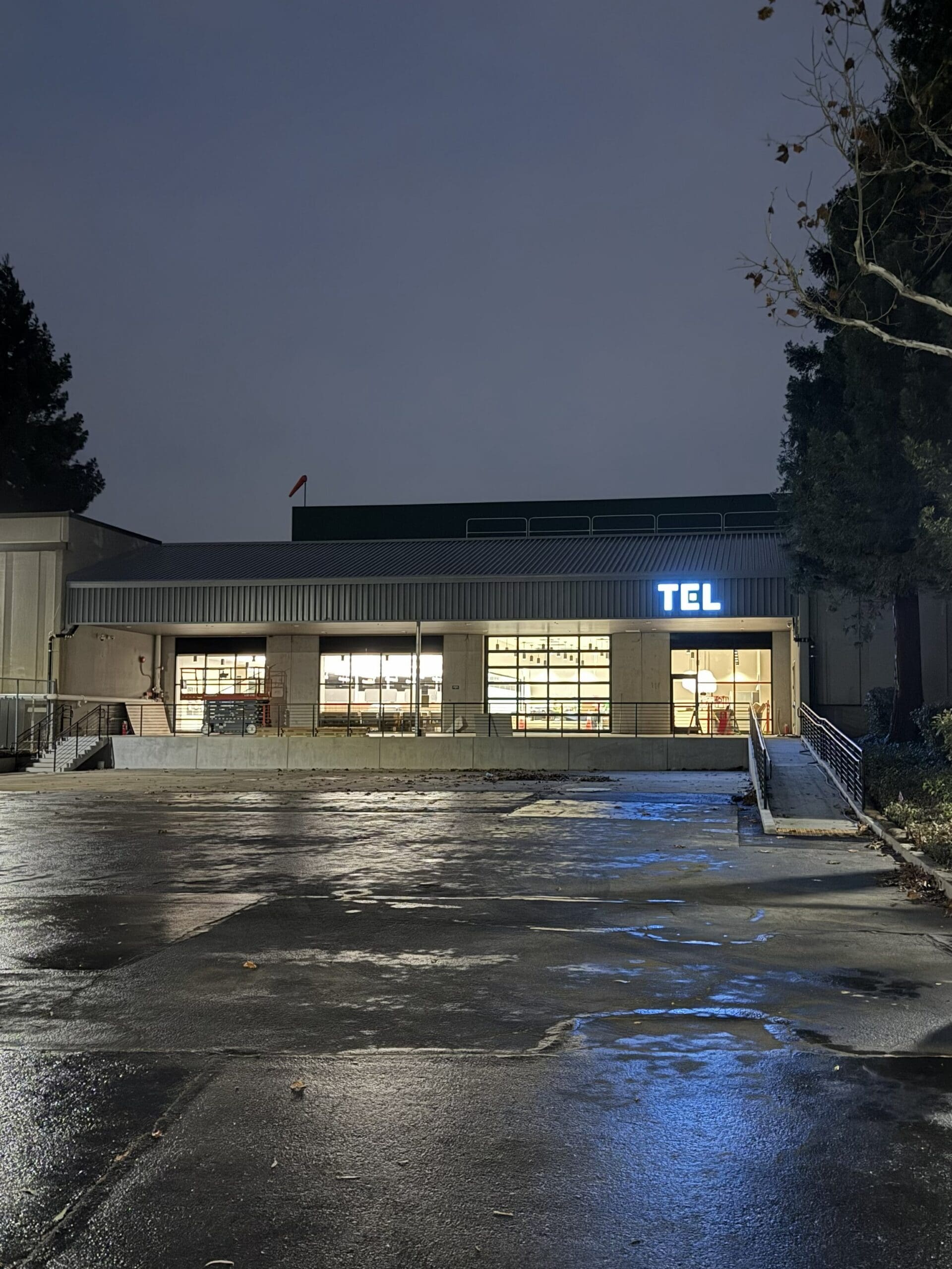 Building exterior with illuminated sign at night